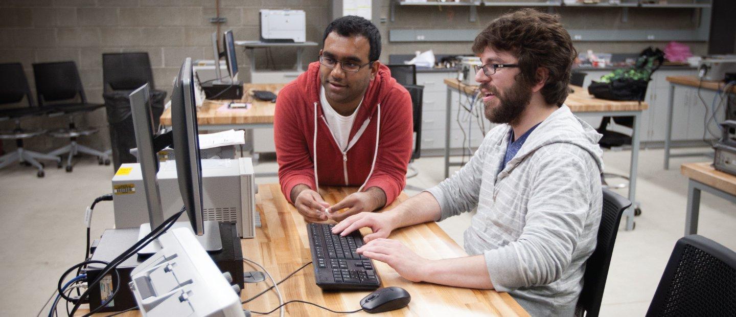 2 students working on a computer